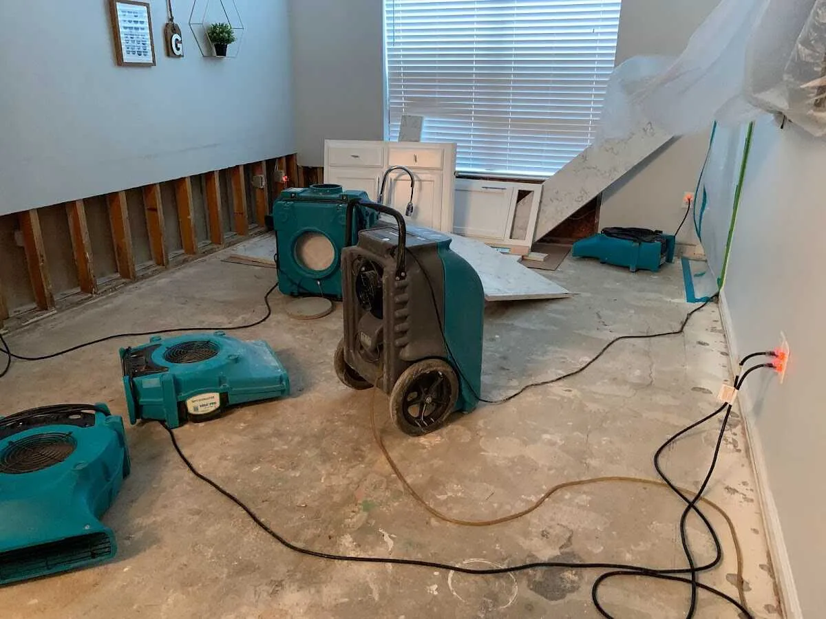 Dehumidifier in flood-cut room for Water Damage Restoration in Corning